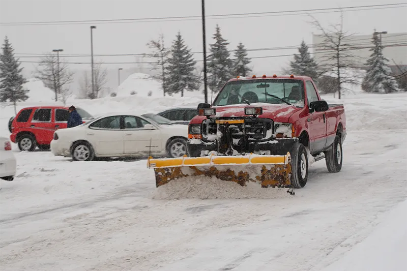 snow plow parking lot cars