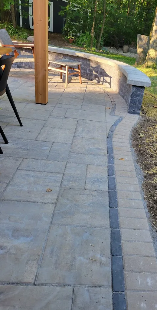 stone patio pavers edging with a sitting wall